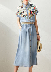 Elegante vestido ceñido con cuello Peter Pan en azul vaquero y estampado de patchwork